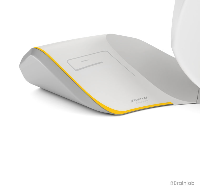 Detail of the floor unit of the Brainlab ExacTrac Dynamic showing the yellow details to enhance the brand identity