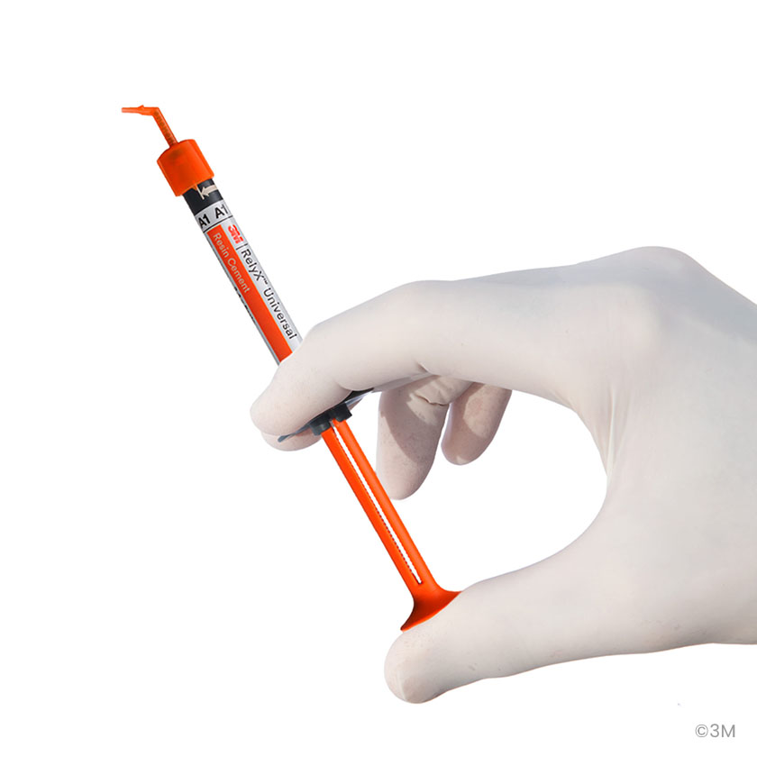 hand holds 3M RelyX Syringe showing the great ergonomics