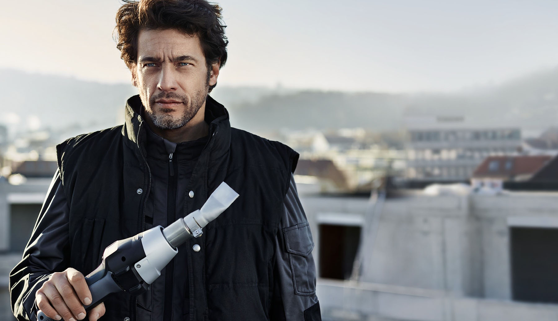 Man Holding a Steinel Heat gun showing the powerful industrial design
