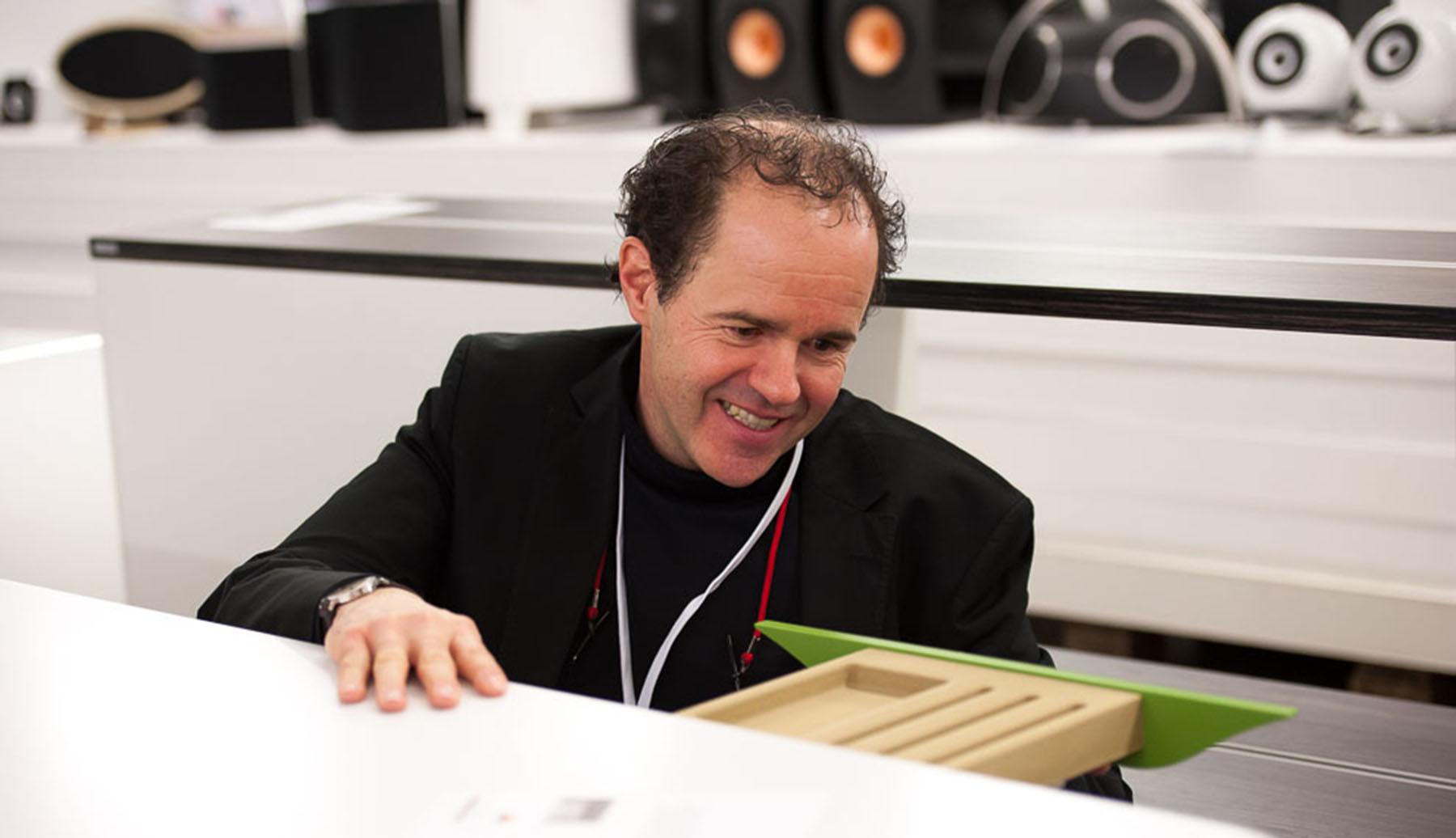 Stefan Eckstein examine a product at the red dot jury