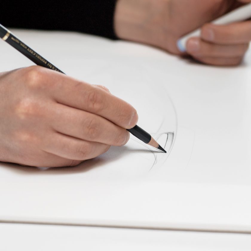 a person sketching in an industrial design style