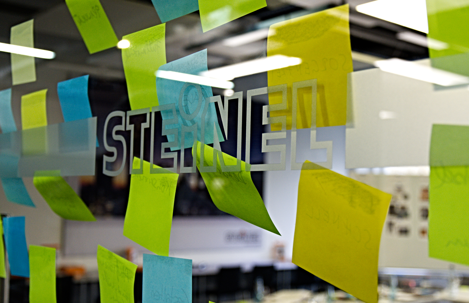 Post-its on a glass wall