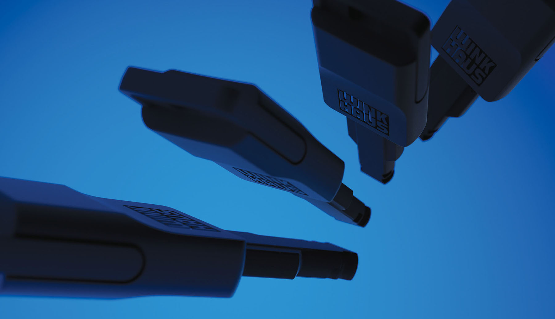 detial view of 4 winkhaus blueEvo keys in black on blue background highleighting the sleek minimalistic industrial design